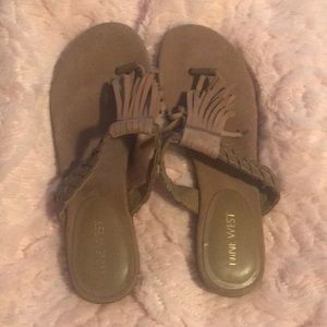 Brown tassel flip flops